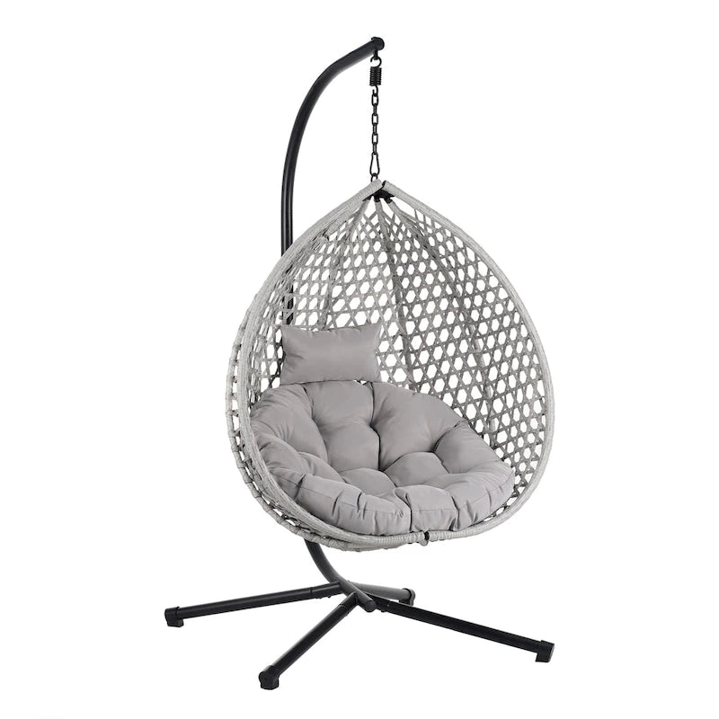 Fauteuil suspendu polyvalent pour l'intérieur et l'extérieur, en rotin PE, avec support et coussin.