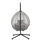 Fauteuil suspendu polyvalent pour l'intérieur et l'extérieur, en rotin PE, avec support et coussin.