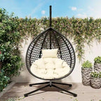 Fauteuil suspendu polyvalent pour l'intérieur et l'extérieur, en rotin PE, avec support et coussin.