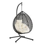 Fauteuil suspendu polyvalent pour l'intérieur et l'extérieur, en rotin PE, avec support et coussin.