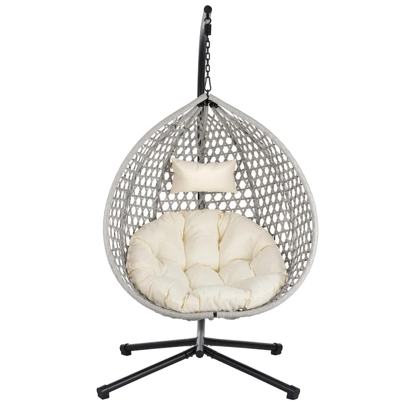 Fauteuil suspendu polyvalent pour l'intérieur et l'extérieur, en rotin PE, avec support et coussin.