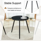 Ensemble repas décontracté pour balcon extérieur, composé d'une table basse ronde moderne anti-déversement, de deux chaises pivotantes en rotin et de coussins.