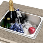 Table à manger avec foyer extérieur, seau à glace et brasero intégré.