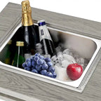 Table à manger avec foyer extérieur, seau à glace et brasero intégré.