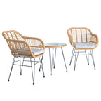Ensemble bistro d'extérieur 3 pièces en rotin tressé avec coussins et table.